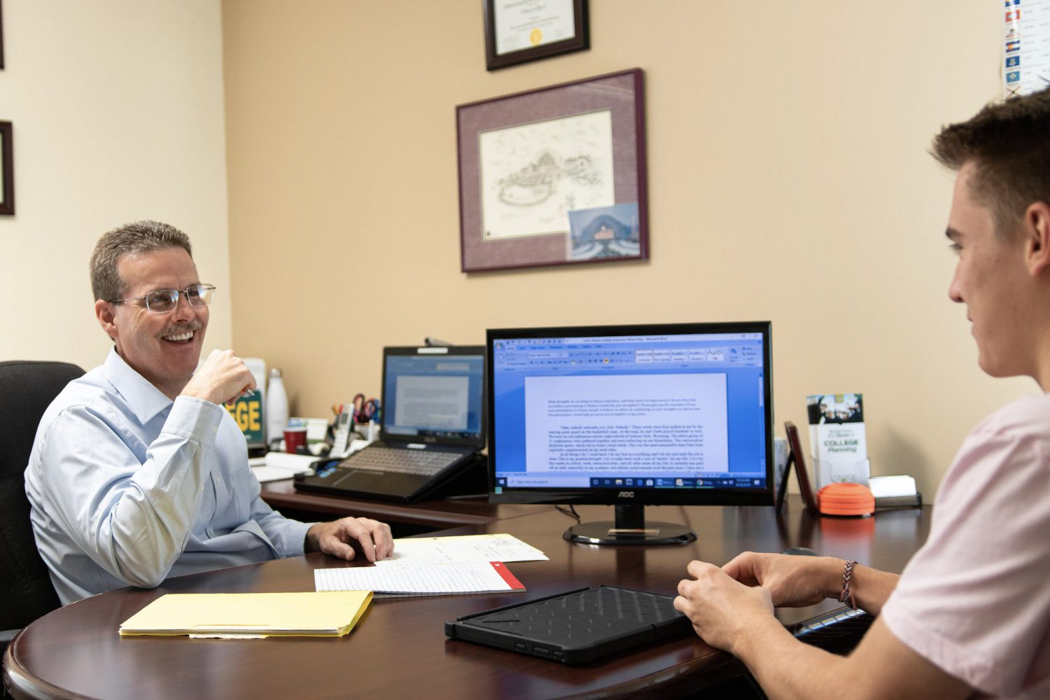 Dan Bisig laughing with student